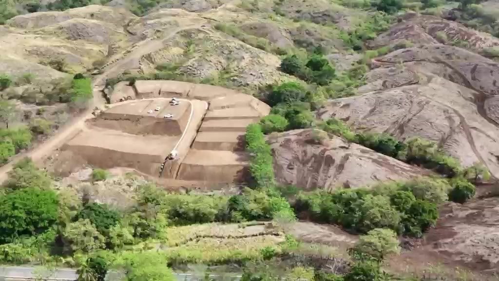 Stepped terraces being graded among the dry season hills