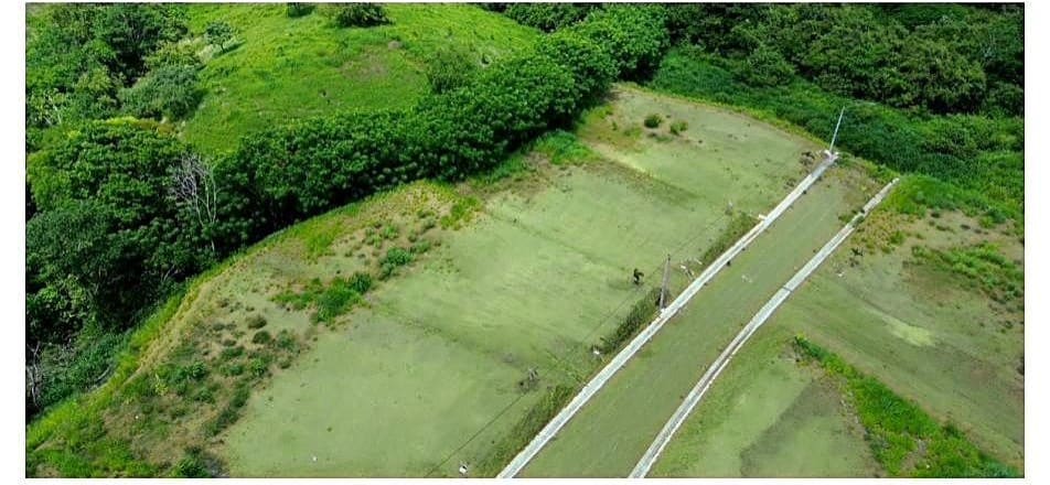 Aerial view of the paved access road running through the graded lots